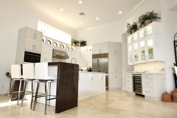 Contemporary White UltraCraft Cabinets and Porcelain Counters