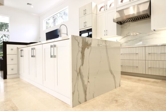 Contemporary White UltraCraft Cabinets and Porcelain Countertops