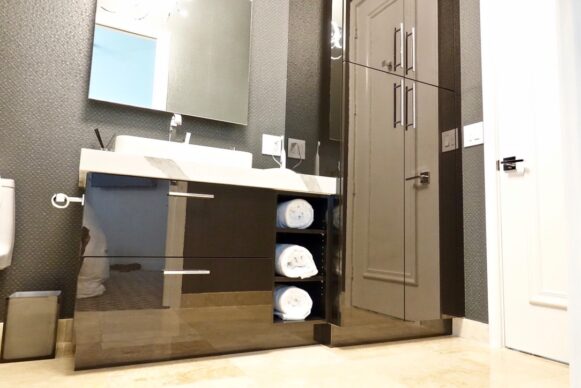 Modern UltraCraft Bathroom Cabinets with Caesarstone Countertops