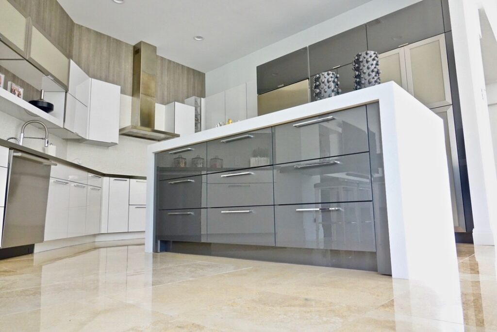 Modern UltraCraft Kitchen Cabinets with Caesarstone Countertops