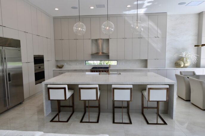 Sleek Milino Kitchen Cabinets and White Quartz Counter