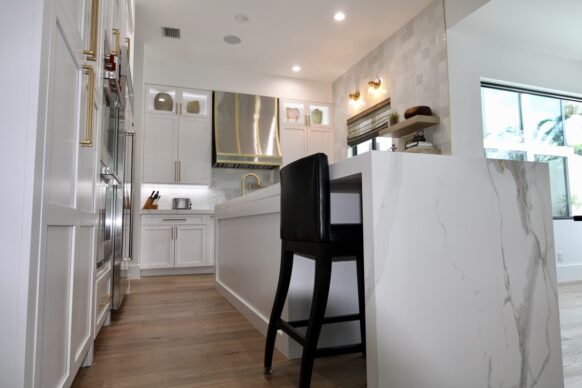 White UltraCraft Cabinets with White Porcelain Counters