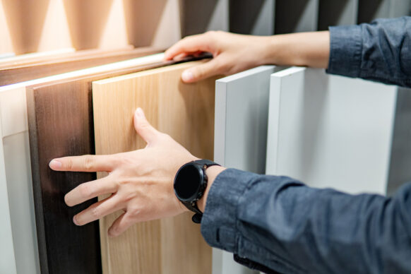 Man chooses from different cabinet faces